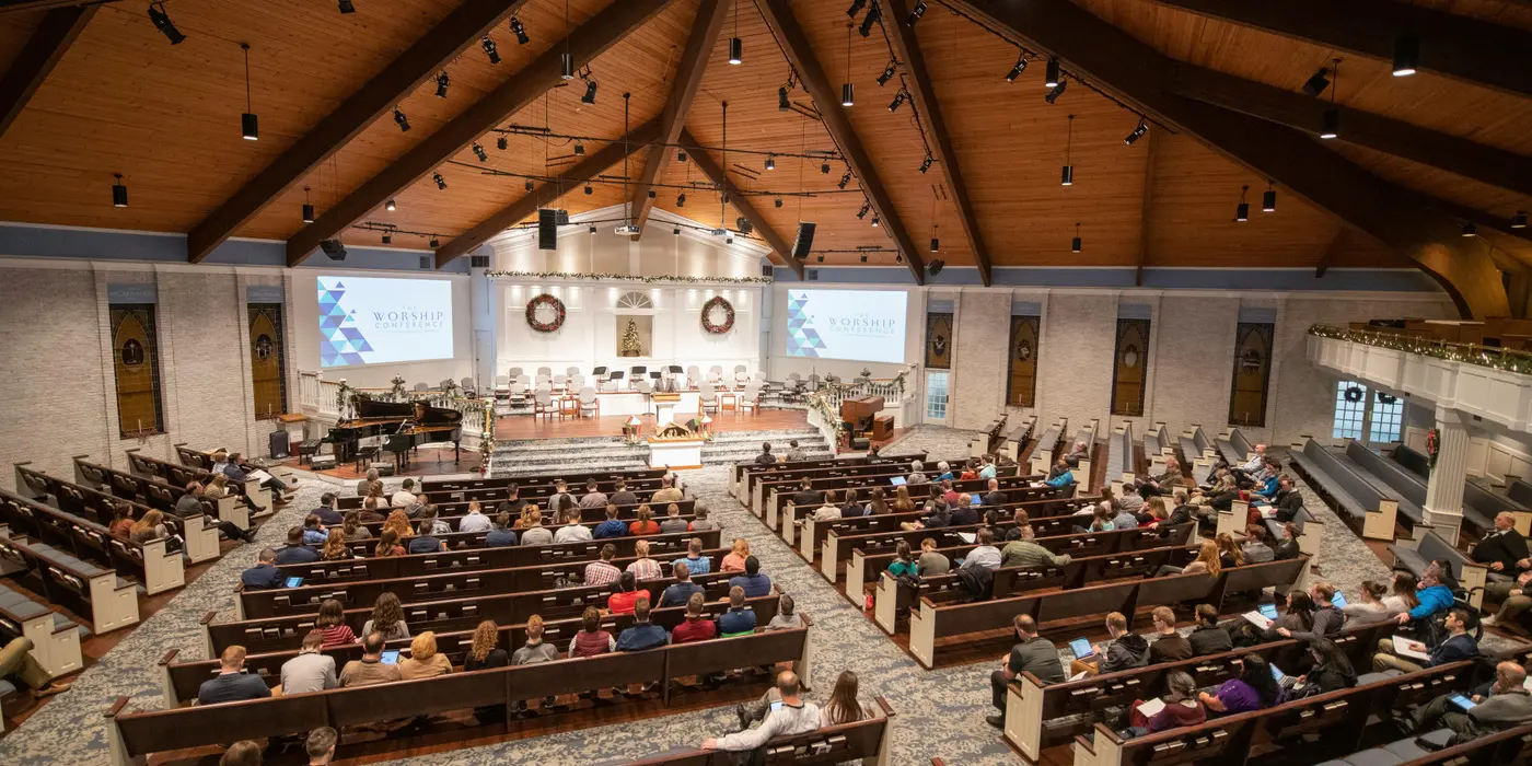 a large congregation listening to a minister sermon from Life Church Leander in Leander, TX - Women Bible Study Ministry